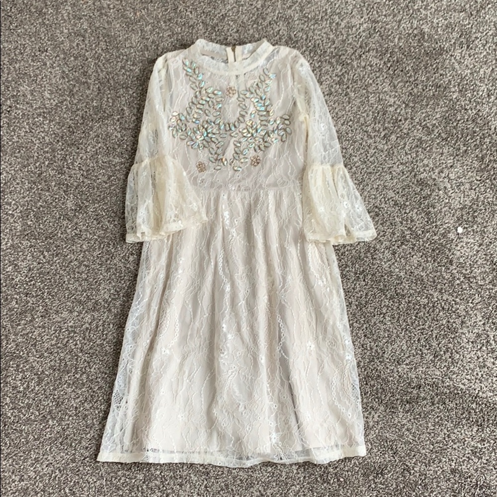 Joyfolie lace dress with beaded front.